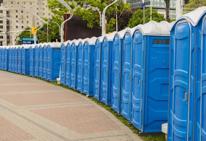 a row of portable restrooms set up for a large athletic event, allowing participants and spectators to easily take care of their needs in West Dundee IL